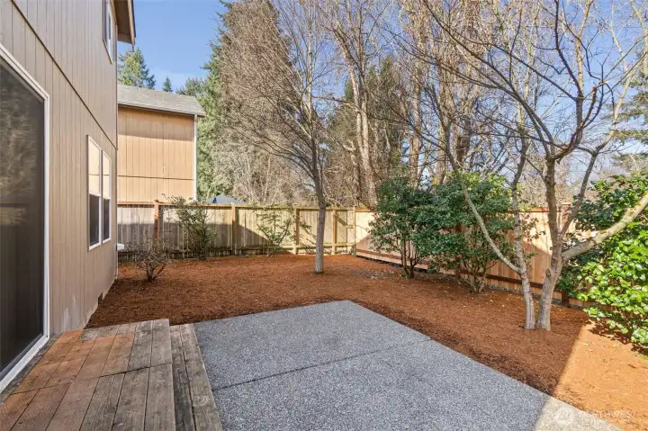 Private, low maintenance backyard that is fully fenced and backs up to the woodland Creek Trail.