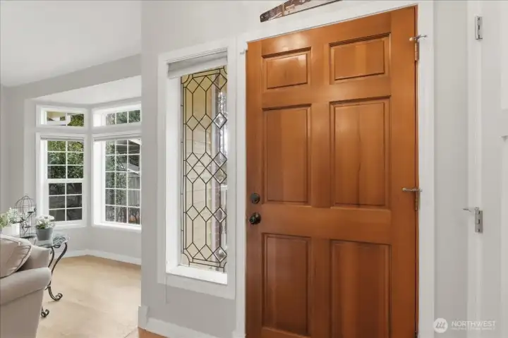 Front door, beautiful glass side light and bay window in Living Room