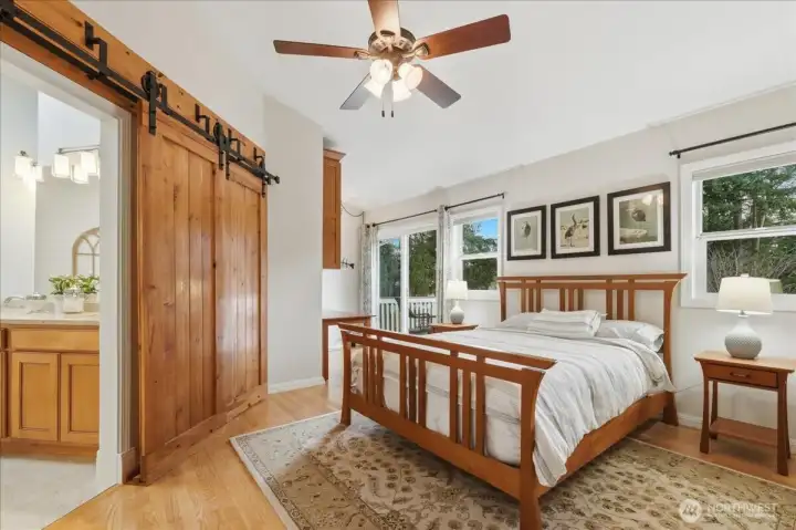 Primary bedroom, custom sliding "barn door" to ensuite bath.