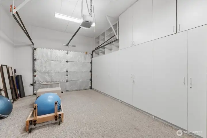 1 bay of 3 car garage with built in storage cabinets. Can be removed for Open Garage if desired.