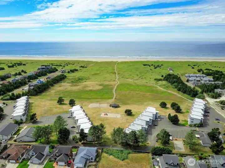 Prime location surrounded by popular amenities make this a highly desirable and rentable coastal getaway— direct Discovery Trail access, golf, and paths through the dunes to...
