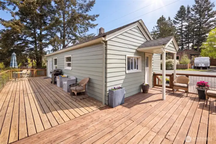 Set on a desirable corner lot in a quiet Friday Harbor neighborhood, this newly painted 1940 charmer sits perched above a sweeping deck that partially wraps around the home and overlooks the spacious, fenced yard with mature evergreens. Located just moments from the ferry terminal, shops, schools, and restaurants, this single-level gem offers the ideal blend of walkable island convenience and serene residential living — with multi-family zoning for up to 4 units (buyer to verify).