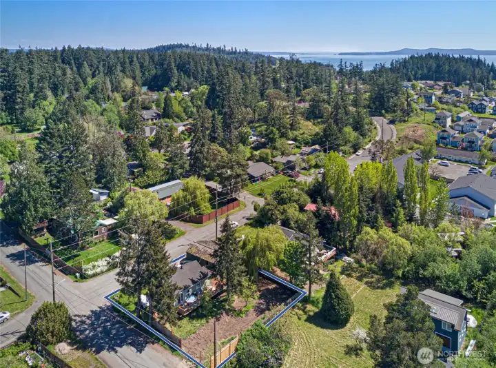 This bird's-eye perspective highlights the property's commanding corner position and spacious lot footprint, situated within a quiet, established residential neighborhood just minutes from all Friday Harbor amenities.