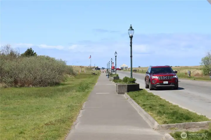 Sidewalk to the Bolstad Beach Approach alongside building