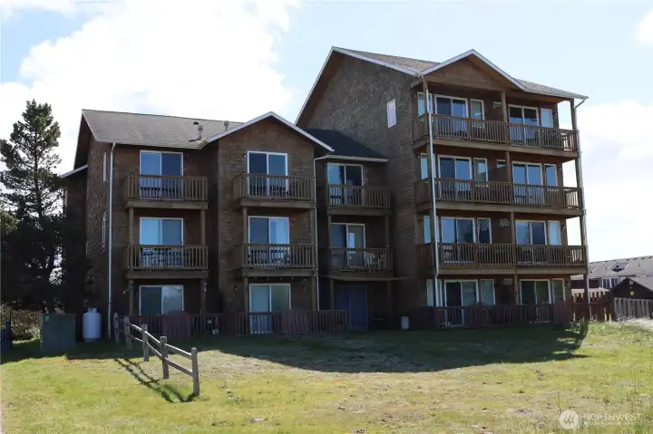 Exterior of building from the beach side showing balconies