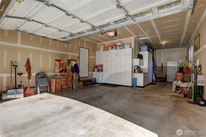 Tandem garage with plenty of storage and shop space.