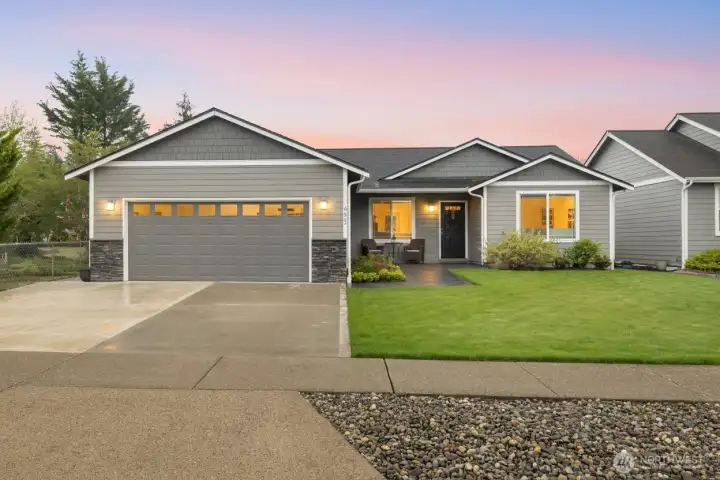 Arrive to a beautifully maintained rambler with attractive curb appeal, stone accents, and a welcoming covered entry.