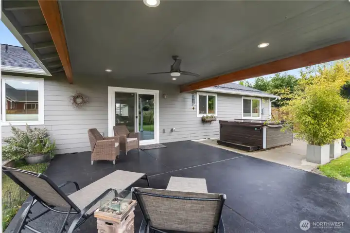 Relax under the spacious covered back patio with room for seating, dining, and year-round outdoor enjoyment.