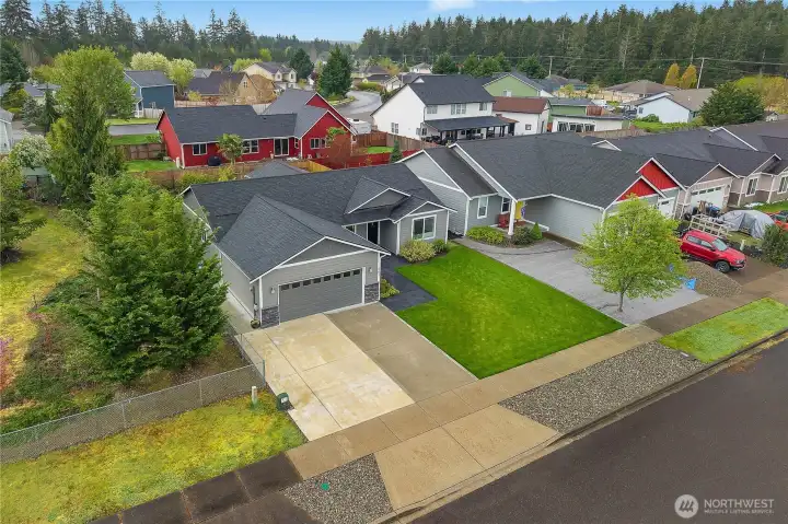 Take in the attractive neighborhood setting with a well-kept exterior, fenced yard, and easy-care landscaping.