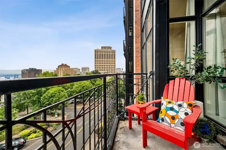You have another deck off the primary bedroom. The city below provides a dynamic scene of urban fascination.