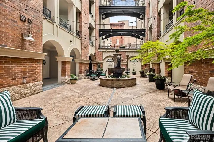 The European style open courtyard is what truly sets The Roberson apart from all other city residences. The historic fountain anchors the space which features arched doorways, overhead balconies, and the skies above!