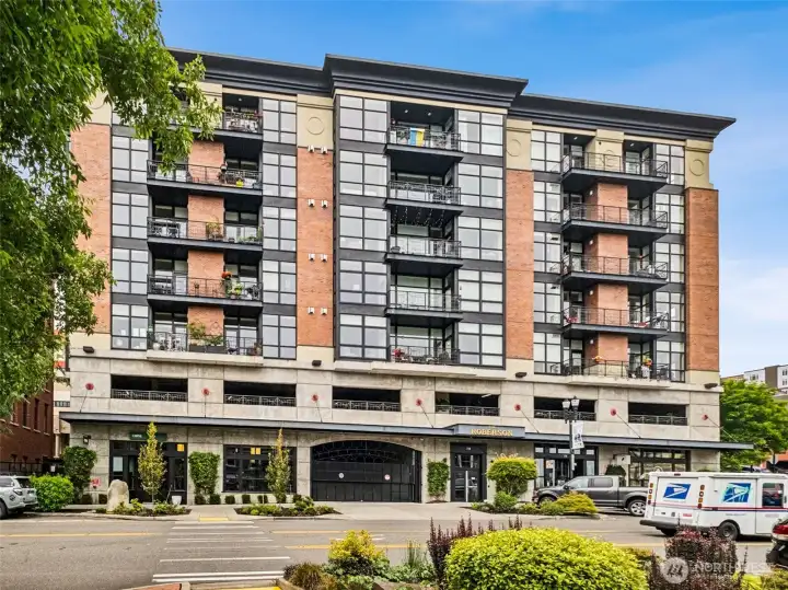 The Roberson Condominiums include commercial spaces on the first flloor: Serenity Spa is on the right of the front entrance.CBRE is a real estate corporate office, located to the left.