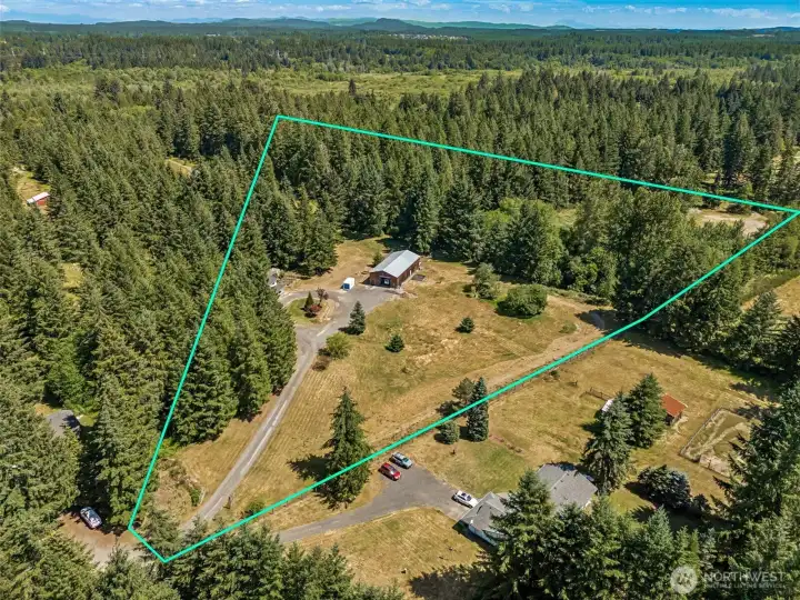 The property's unique triangular configuration creates multiple zones that could easily accommodate a wide variety of lifestyles and future plans. The long driveway leads you deep into the property, where the home and shop enjoy privacy surrounded by open space and mature trees. The broad grassy areas create a wonderful visual buffer while also offering tremendous flexibility for future uses. Whether you're dreaming of horses, hobby farming, expanded gardens, outdoor recreation, or simply having room to spread out and enjoy the peace and quiet, this property provides the canvas. The Delphi location is especially appealing for those seeking a rural feel without sacrificing convenience, and it's served by the highly regarded Tumwater School District, including Little Rock Elementary, George Washington Bush Middle School, and Tumwater High School.
