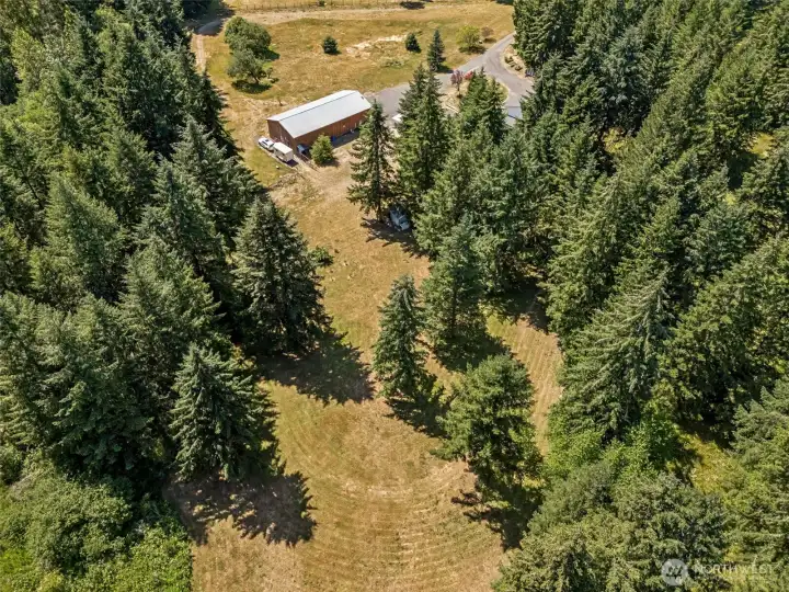 Whether you're dreaming of additional pasture space, expanded gardens, recreational use, or simply enjoying the open landscape, there's plenty of room to make it your own. One of the perks of this property is that it comes equipped with tools to help maintain it. A riding lawn mower, four-wheeler, and utility trailer all stay with the property, giving the next owner a head start on country living. You'll also find a walking trail that loops around the property, perfect for morning strolls, daily exercise, or simply enjoying your five private acres. The property is already fenced along much of the perimeter, with only the rear property line remaining if a fully enclosed boundary is desired.