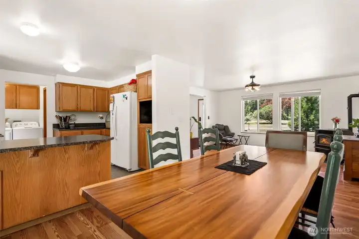 From the dining room, you can appreciate how naturally the kitchen and living room connect, creating a comfortable gathering space that's ideal for both everyday living and larger celebrations. The peninsula offers valuable bonus space that can serve as a breakfast bar, snack station, homework headquarters, or holiday buffet line depending on the occasion. We also love the fact that the kitchen enjoys a little separation from the front entry. Guests are greeted by the warm living spaces while meal prep can happen behind the scenes. The result is a home that feels welcoming, functional, and ready to handle everything from quiet family dinners to full-house holiday gatherings.