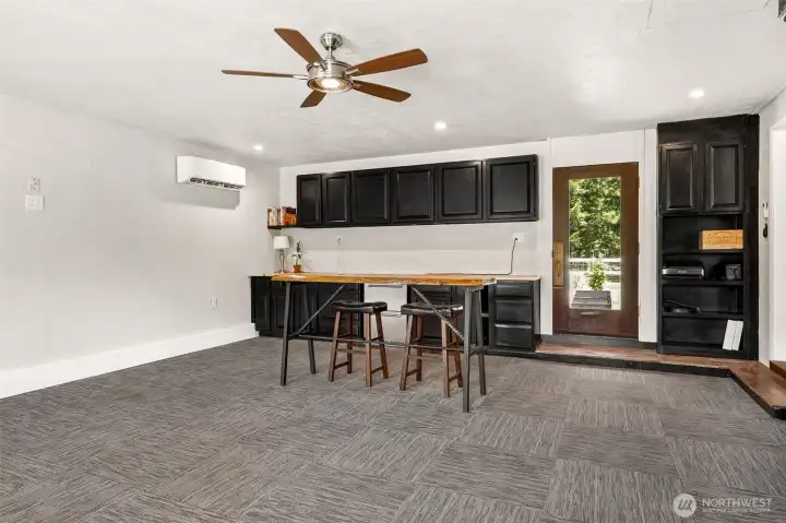 A dedicated mini-split provides customizable heating and cooling, allowing the room to function almost like its own private living space. The built-in countertop offers endless possibilities, from a craft station or office workspace to a coffee bar or future kitchenette setup. Even better, the room enjoys its own exterior entrance to the backyard, creating the kind of separation that's highly desirable for guests, multigenerational households, or anyone looking for a little extra independence. It's easy to imagine this becoming a studio-style retreat, mother-in-law suite, private office, or even an income-producing rental opportunity.