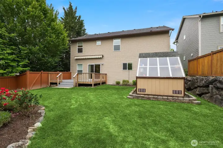 Back of the home, showing shed-greenhouse
