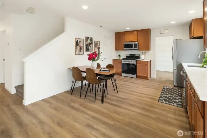 New Countertops, New Appliances, New Floor, Stairs up to Primary and 3 other bedrooms.