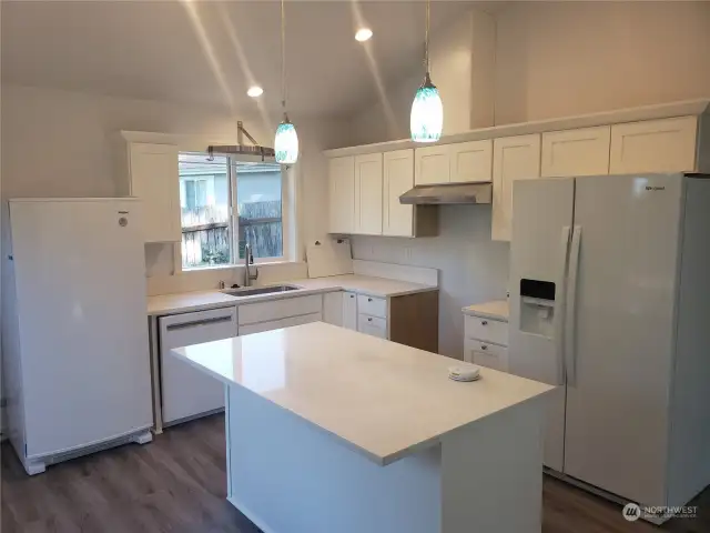Kitchen displays white cabinets