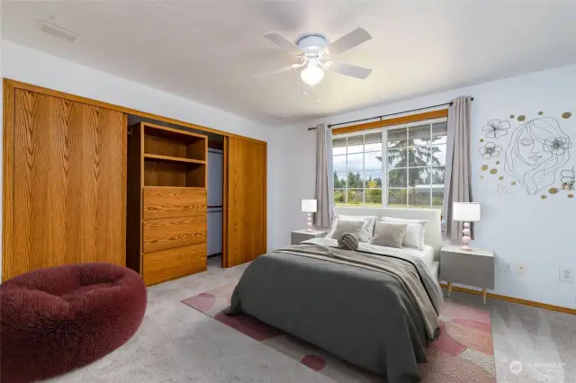 Large bedroom with custom closet and built-ins (virtually staged photo)