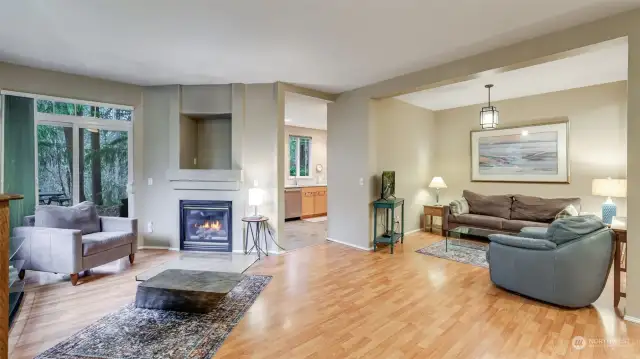 The room to your left is being used as the family room.  There is a gas log fireplace and an opening for the TV.  The sliding door takes you to a wonderful outside deck overlooking the deep private HOA owned greenbelt.