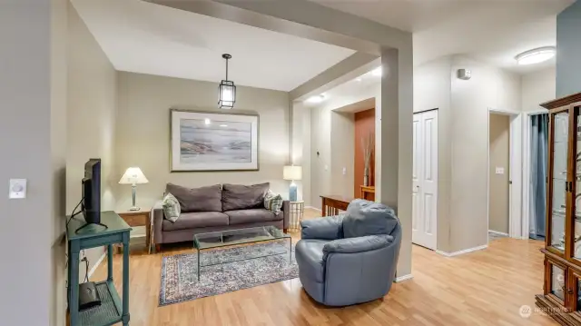 This room was designed to be the dining room but is currently being used as a living room.  The entire home has white enamel finish work and 6 panel doors.