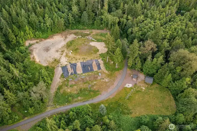 The three boxes (below the black plastic) are part of the storm water system for this house and one neighboring house.  This property will translate into 10,000 gallon run off already covered in your development costs.