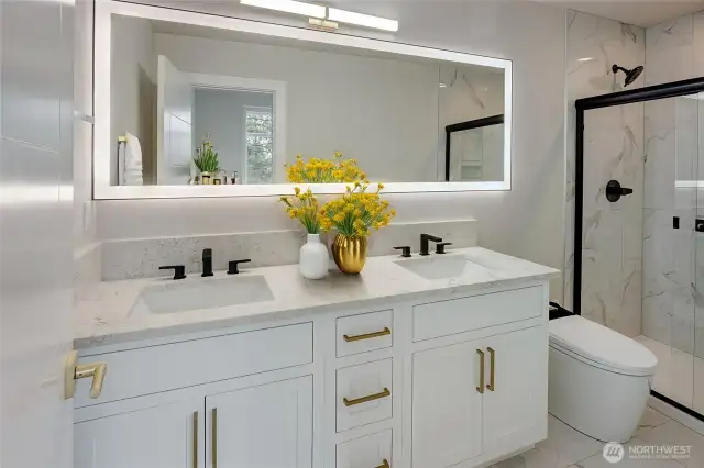 Double vanity smart mirror and smart toilet in primary bath (virtually staged)