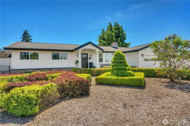 Situated on large corner lot with an abundance of updates throughout. Freshly painted exterior in Greek Villa White and Tricorn Black.
