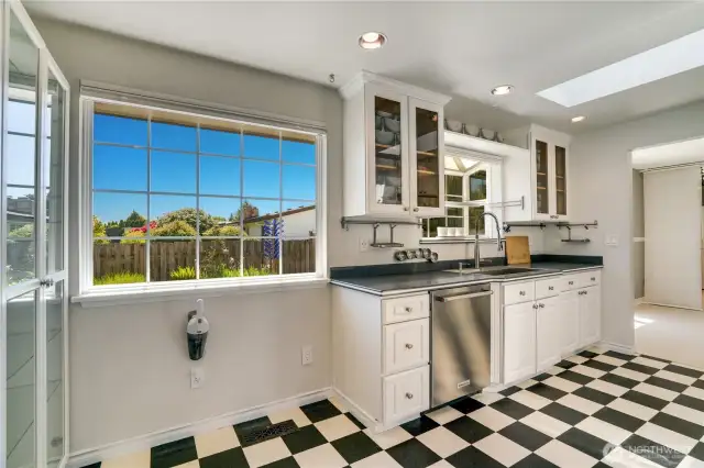 View of eating nook in kitchen looks to backyard.