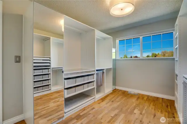 View of 2nd bedroom with built in organizers.
