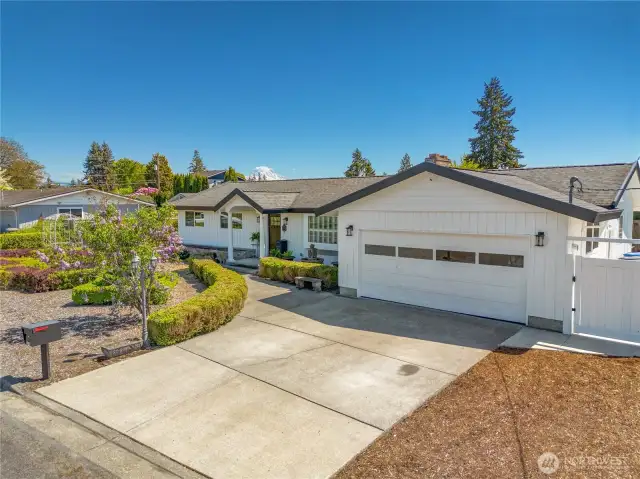Views of Mt Rainier, Many updates throughout, newer roof, freshly painted exterior, professionally landscaped with English boxwoods and lilacs.