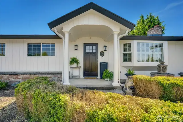 Welcoming front porch, updated door, security system.
