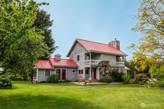 Main house, seen from within fenced vegetable and flower garden