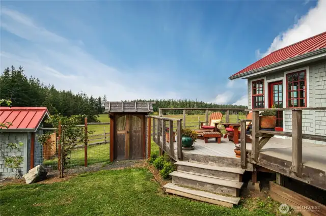 Gate from the west side deck out to the pasture and one of the ponds