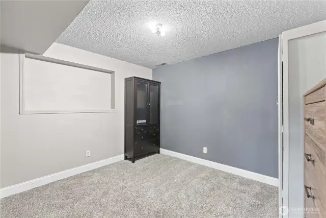 Flex room currently functioning as a closet for lower level bedroom.