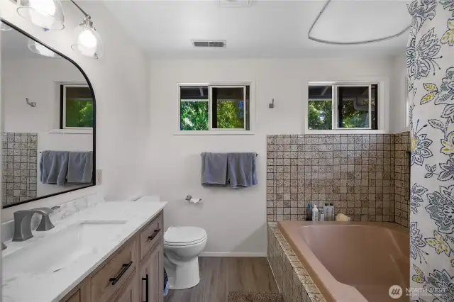Updated bath! Stone counter and new vanity and floor.