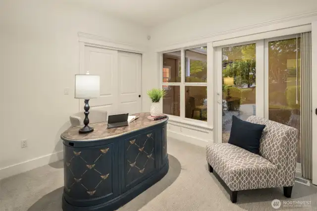 Third upstairs bedroom staged as a den.