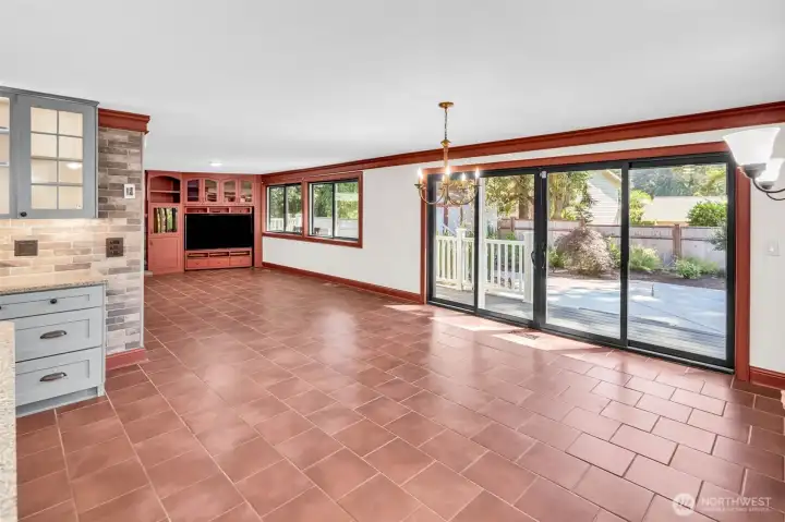 Massive dining space with custom sliding glass door to backyard