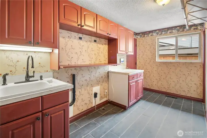 Laundry room with brand new tile flooring