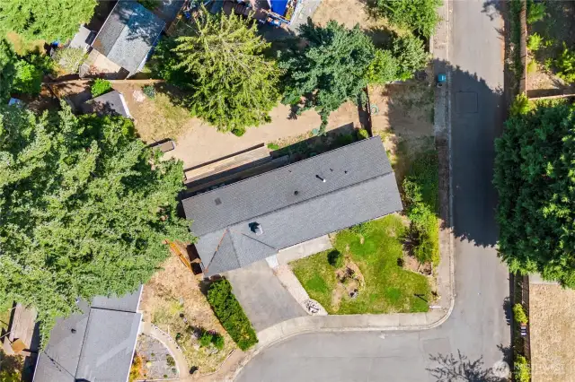 Get a true sense of space with this aerial view of the North Hill rambler. Situated on a corner lot with a spacious backyard and deck, this home offers privacy in a quiet double cul-de-sac setting.