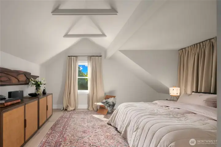 Subtle architectural lines and layered textures create a calming balance of comfort and sophistication. This room offers both western and northern exposure.