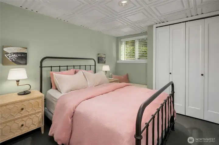 The first of two bedrooms in the ADU, this serene space features soft hues, warm natural light, and ample closet storage—an inviting retreat for guests or tenants.