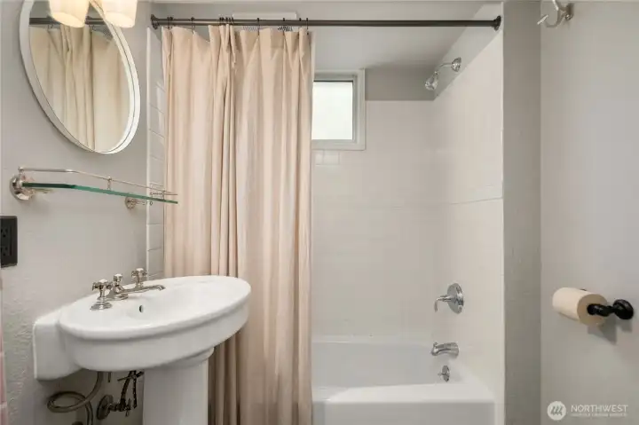 This lovely full bathroom in the ADU offers every convenience along with designer charm.