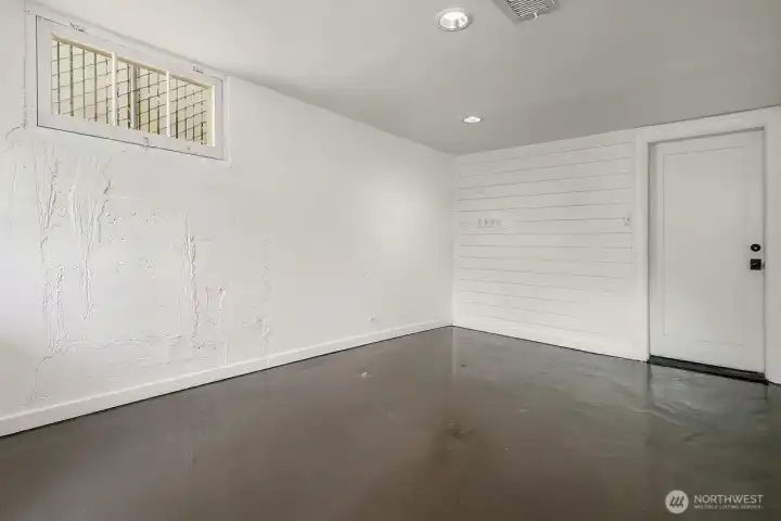 The garage interior provides clean, versatile space with direct access to the home.