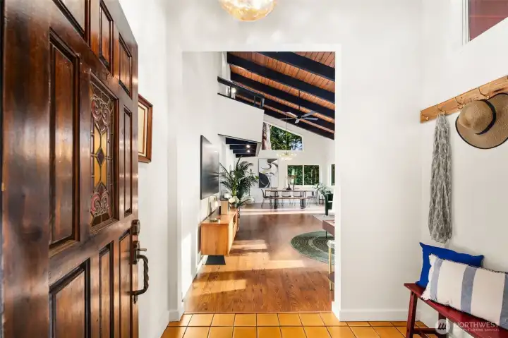 Entering on the main floor, handy mudroom/coat area, through to a big, vaulted space.