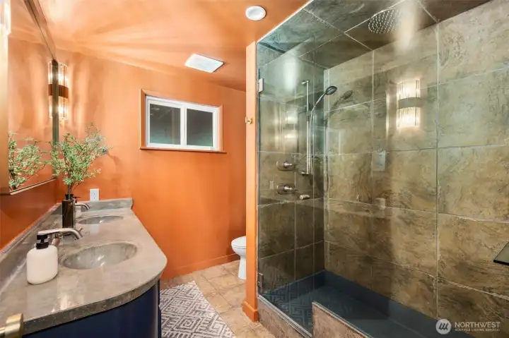 This is the bath on the main floor, concrete counters, moody lighting.
