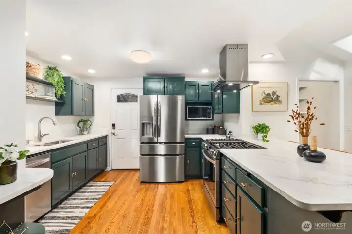Kitchen adjoins the carport for easy unloading, pantry far right. SO much storage!