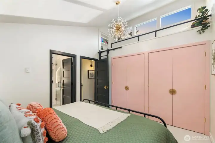 A ladder up to the nook and hidden attic storage past the bookcase.
