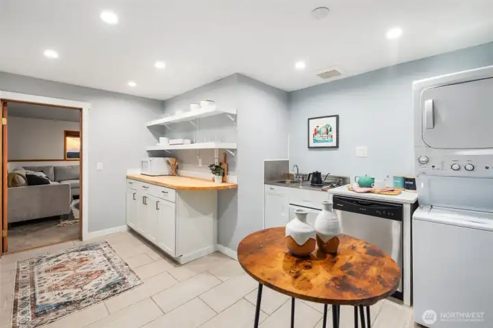 Kitchenette w/ separate laundry is so useful for long term guests w/ AirBnB potential!